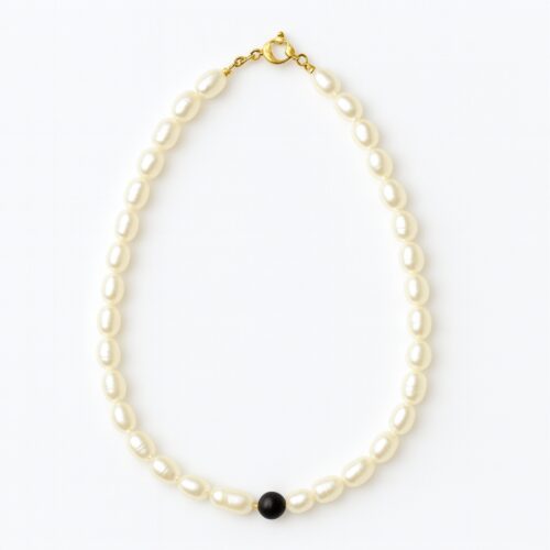 Natural pearl necklace with a single black bead, elegant handmade jewelry for women.