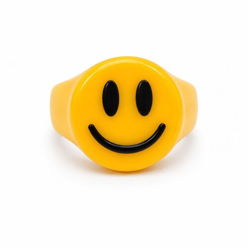 Yellow smiley face statement ring with black happy face design